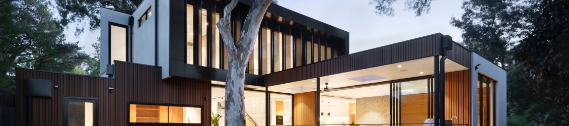 square shaped house designed with glass, concrete and steal