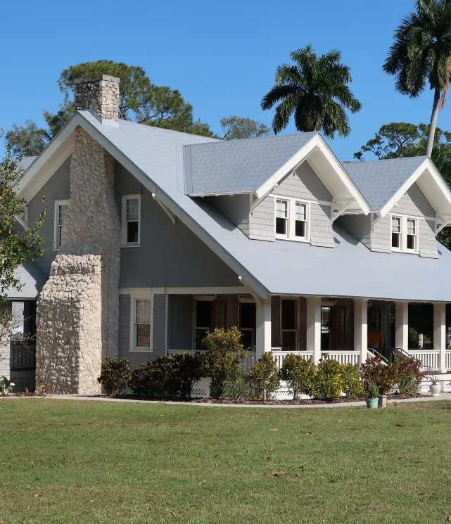 double-decker house with a beautiful front porch